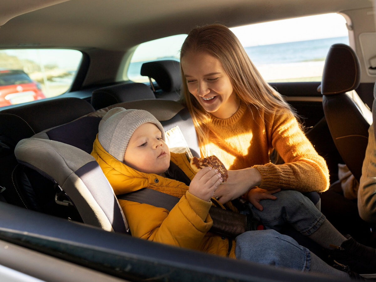 A child seat fitted in the rear of a vehicle